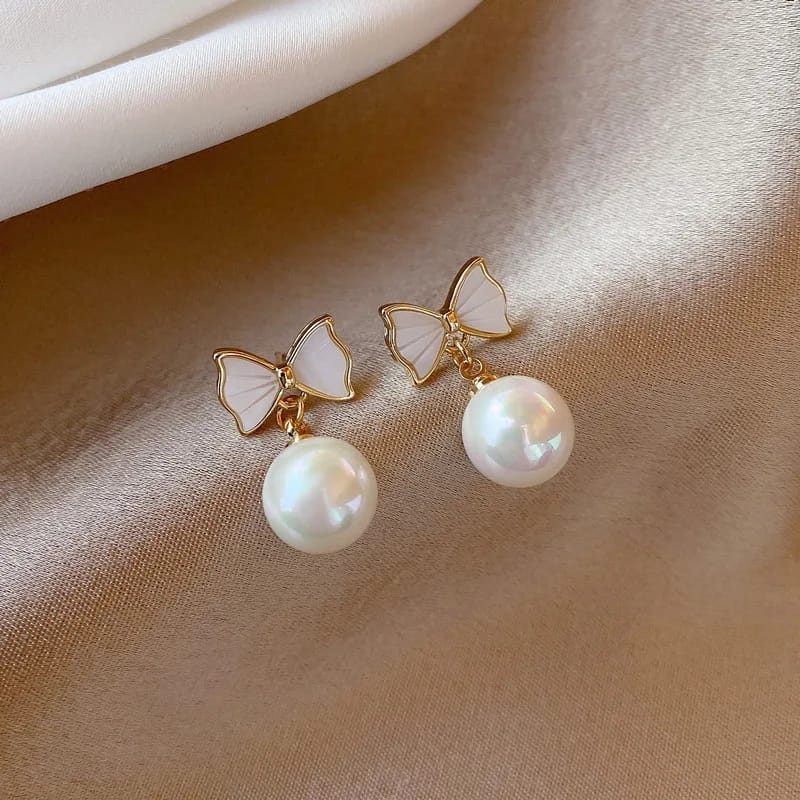 Women's pearl bow earrings